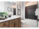 Bathroom with dark tile shower and modern vanity at 4072 Bannock Ave, Tavares, FL 32778