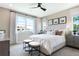 Large main bedroom with a king-size bed and plenty of natural light at 4072 Bannock Ave, Tavares, FL 32778