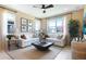 Spacious living room with a comfortable sectional sofa and large windows at 4072 Bannock Ave, Tavares, FL 32778