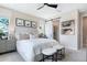 Modern main bedroom with a king-size bed and en-suite bathroom access at 4072 Bannock Ave, Tavares, FL 32778