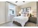 Bedroom with wood nightstands and an accent wall at 4072 Bannock Ave, Tavares, FL 32778