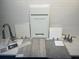 Modern kitchen with wood cabinets, quartz countertops, and island at 4072 Bannock Ave, Tavares, FL 32778