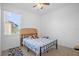 Bright bedroom with a double bed, window, and ceiling fan at 4523 Ashtubula Ct, Orlando, FL 32818