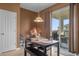 Cozy breakfast nook with table and chairs, near sliding glass doors at 4523 Ashtubula Ct, Orlando, FL 32818