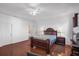 Bright bedroom featuring wood floors and a ceiling fan at 4523 Ashtubula Ct, Orlando, FL 32818