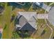 Housetop view of single-Gathering home with grey roof and large backyard at 4523 Ashtubula Ct, Orlando, FL 32818
