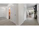 Clean hallway with doors to bathroom and other rooms at 6883 Botanic Blvd, Harmony, FL 34773