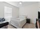 Charming bedroom featuring a full-size bed and window blinds at 6883 Botanic Blvd, Harmony, FL 34773