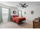 Bright bedroom with a ceiling fan and large windows at 6883 Botanic Blvd, Harmony, FL 34773