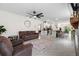 Open-concept living area showcasing a kitchen and dining area at 6883 Botanic Blvd, Harmony, FL 34773