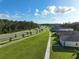 Community overview showcasing homes and a walking path at 6883 Botanic Blvd, Harmony, FL 34773