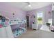 Cozy bedroom with bunk beds, window seat, and built-in shelving at 6883 Botanic Blvd, Harmony, FL 34773