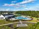 Community pool with expansive deck and playground at 6883 Botanic Blvd, Harmony, FL 34773