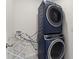 Convenient laundry room with stacked washer and dryer at 6883 Botanic Blvd, Harmony, FL 34773