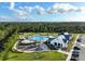 Community pool and clubhouse with playground nearby at 6883 Botanic Blvd, Harmony, FL 34773