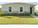 Single-story house with stone accents and landscaping at 6883 Botanic Blvd, Harmony, FL 34773