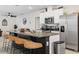 Modern kitchen with island, granite countertops, and stainless steel appliances at 6883 Botanic Blvd, Harmony, FL 34773