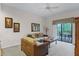 Living room with wicker furniture and balcony access at 9051 Treasure Trove Ln # 307, Kissimmee, FL 34747