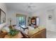 Living room with wicker furniture and balcony view at 9051 Treasure Trove Ln # 307, Kissimmee, FL 34747
