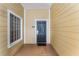 Building entryway with black door and frosted glass window at 9051 Treasure Trove Ln # 307, Kissimmee, FL 34747