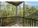 Spacious screened balcony overlooking lush greenery at 9051 Treasure Trove Ln # 307, Kissimmee, FL 34747