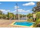 Community hot tub with tranquil water and surrounding greenery at 9051 Treasure Trove Ln # 307, Kissimmee, FL 34747