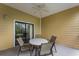 Private balcony with seating area and ceiling fan at 9051 Treasure Trove Ln # 307, Kissimmee, FL 34747