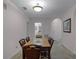 Dining area with table and chairs, bathroom access at 9051 Treasure Trove Ln # 307, Kissimmee, FL 34747