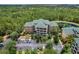Condo building nestled in a wooded area near a lake at 9051 Treasure Trove Ln # 307, Kissimmee, FL 34747