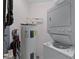 Stackable washer and dryer in the laundry room at 9051 Treasure Trove Ln # 307, Kissimmee, FL 34747