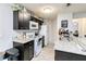 Kitchen with granite countertops and dark cabinets at 976 Leeward Pl # 102, Altamonte Springs, FL 32714