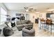Open living room with sectional sofa and kitchen at 976 Leeward Pl # 102, Altamonte Springs, FL 32714
