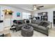 Living room with sectional sofa and laundry area at 976 Leeward Pl # 102, Altamonte Springs, FL 32714