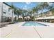 Community pool with lounge chairs at 976 Leeward Pl # 102, Altamonte Springs, FL 32714