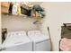 Laundry room with washer and dryer and overhead shelving at 976 Leeward Pl # 102, Altamonte Springs, FL 32714