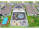 High-angle view of home and pool; solar panels visible at 1927 Partin Terrace Rd, Kissimmee, FL 34744