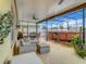 Screened patio with comfortable seating and a round above ground pool at 1927 Partin Terrace Rd, Kissimmee, FL 34744