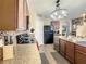 Modern kitchen with dark cabinetry and granite countertops at 1927 Partin Terrace Rd, Kissimmee, FL 34744