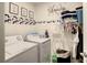 Convenient laundry room with washer, dryer, and storage at 1927 Partin Terrace Rd, Kissimmee, FL 34744