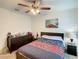 Serene bedroom with a queen bed and ample dresser space at 1927 Partin Terrace Rd, Kissimmee, FL 34744