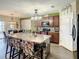 Open kitchen boasts island, ample counter space, and stylish lighting at 1927 Partin Terrace Rd, Kissimmee, FL 34744