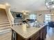 Kitchen island with breakfast bar overlooks living room at 1927 Partin Terrace Rd, Kissimmee, FL 34744