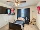 Charming bedroom with a single bed and plenty of natural light at 1927 Partin Terrace Rd, Kissimmee, FL 34744