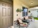 Inviting front porch with seating area and potted plants at 1927 Partin Terrace Rd, Kissimmee, FL 34744