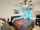 Relaxing bedroom with a queen bed, desk, and calming decor at 1927 Partin Terrace Rd, Kissimmee, FL 34744