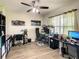 Spacious home office with two desks and ample natural light at 1927 Partin Terrace Rd, Kissimmee, FL 34744