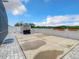 Large backyard with concrete patio, storage shed, and trampoline at 1927 Partin Terrace Rd, Kissimmee, FL 34744