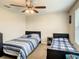 Charming bedroom with two twin beds and plenty of natural light at 1927 Partin Terrace Rd, Kissimmee, FL 34744