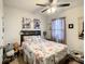 Well-lit bedroom with a queen bed and Parisian decor at 1927 Partin Terrace Rd, Kissimmee, FL 34744