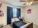Cozy bedroom with a single bed and decorative wall art at 1927 Partin Terrace Rd, Kissimmee, FL 34744